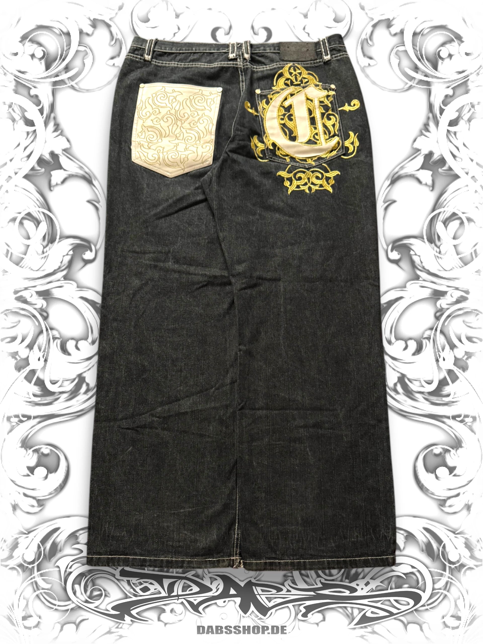 Baggy cotton denim pants with golden embroidery details in a vintage Y2K streetwear style.