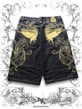 Vintage-washed baggy denim jorts with golden wing embroidery and metallic stud details in jesse pinkman style.
