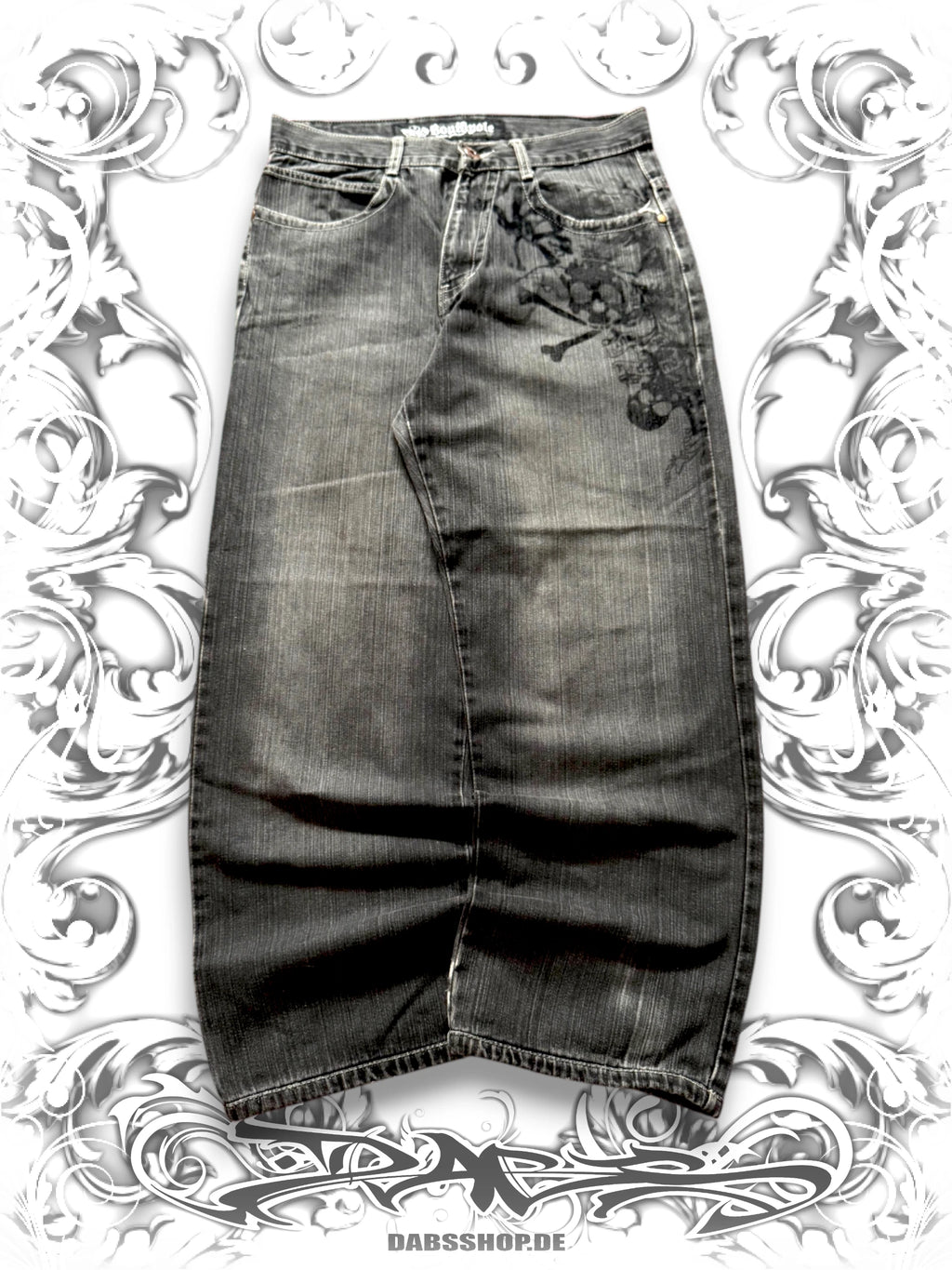 Dark wash Southpole wide-leg jeans with Skullpile Crossbone graphic and faded Y2K streetwear styling, front view