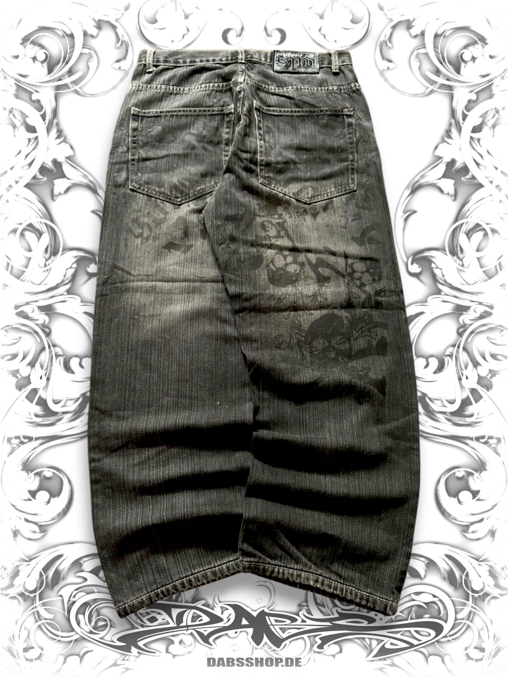 Dark wash Southpole wide-leg jeans with Skullpile Crossbone graphic and faded Y2K streetwear styling, back view,