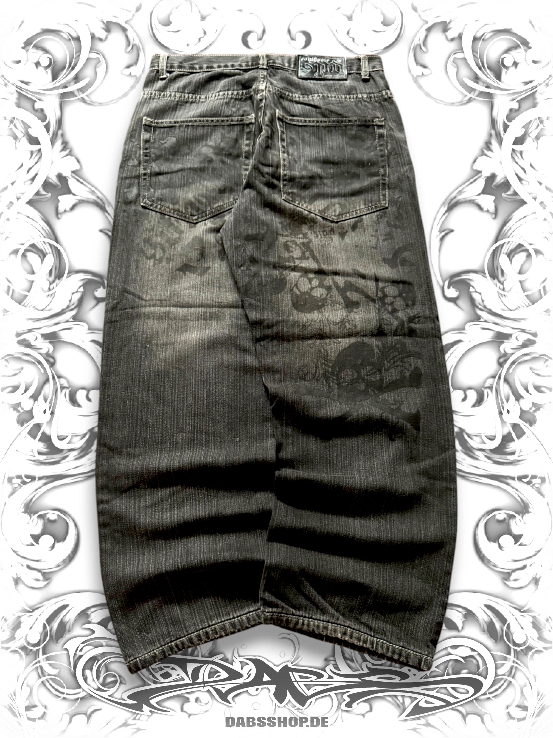 Dark wash Southpole wide-leg jeans with Skullpile Crossbone graphic and faded Y2K streetwear styling, back view,