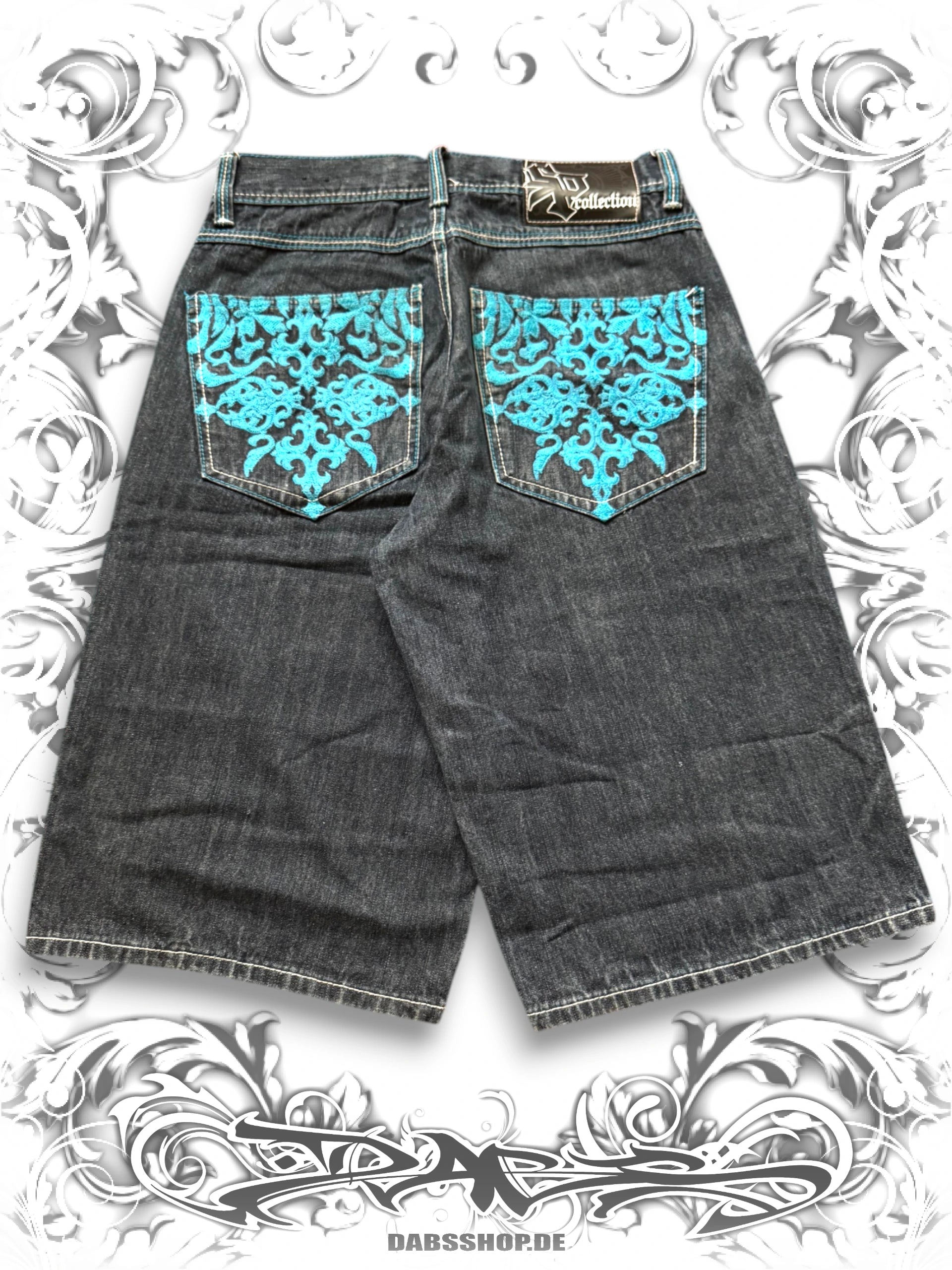 Blue Southpole wide-leg jorts with tribal embroidery and contrast stitching in a vintage Y2K denim style.