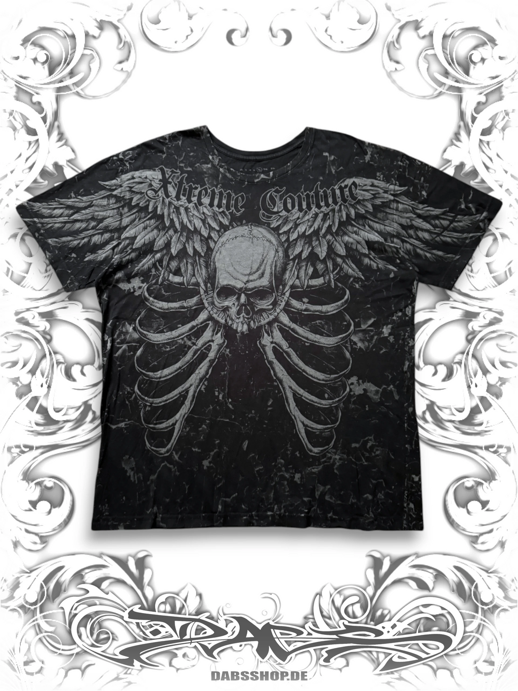 Xtreme Couture 2000s T-shirt with winged skull graphic and alternative Y2K style