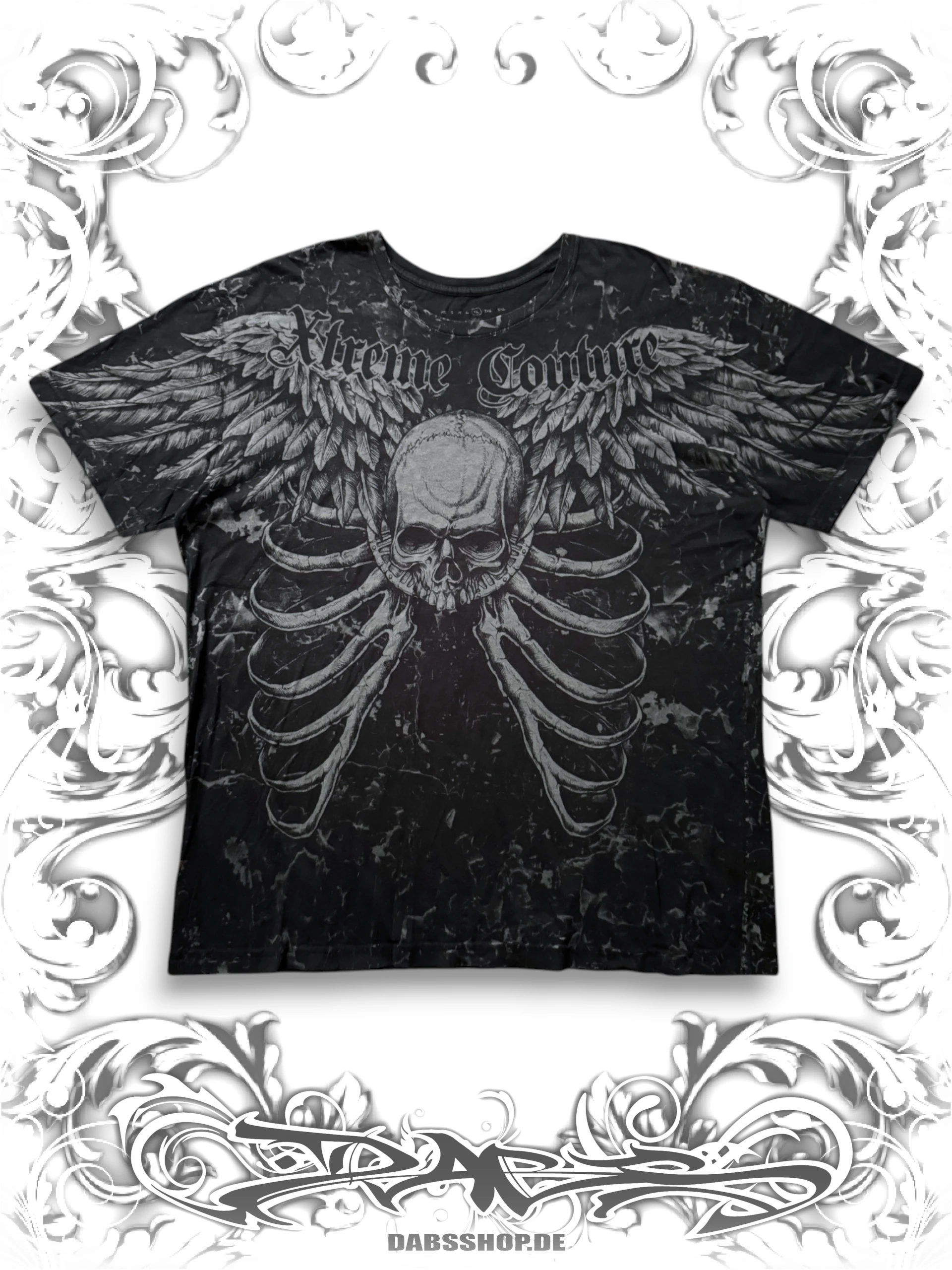 Xtreme Couture 2000s T-shirt with winged skull graphic and alternative Y2K style